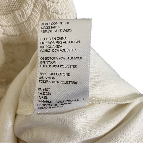 PINS & NEEDLES | Ivory Sleeveless Lace Cutout Back Peplum Mini Cocktail Dress - Picture 10 of 11